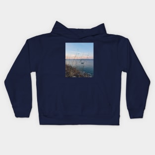 Serene Ocean Sunset: Boat Amidst Weeds Kids Hoodie